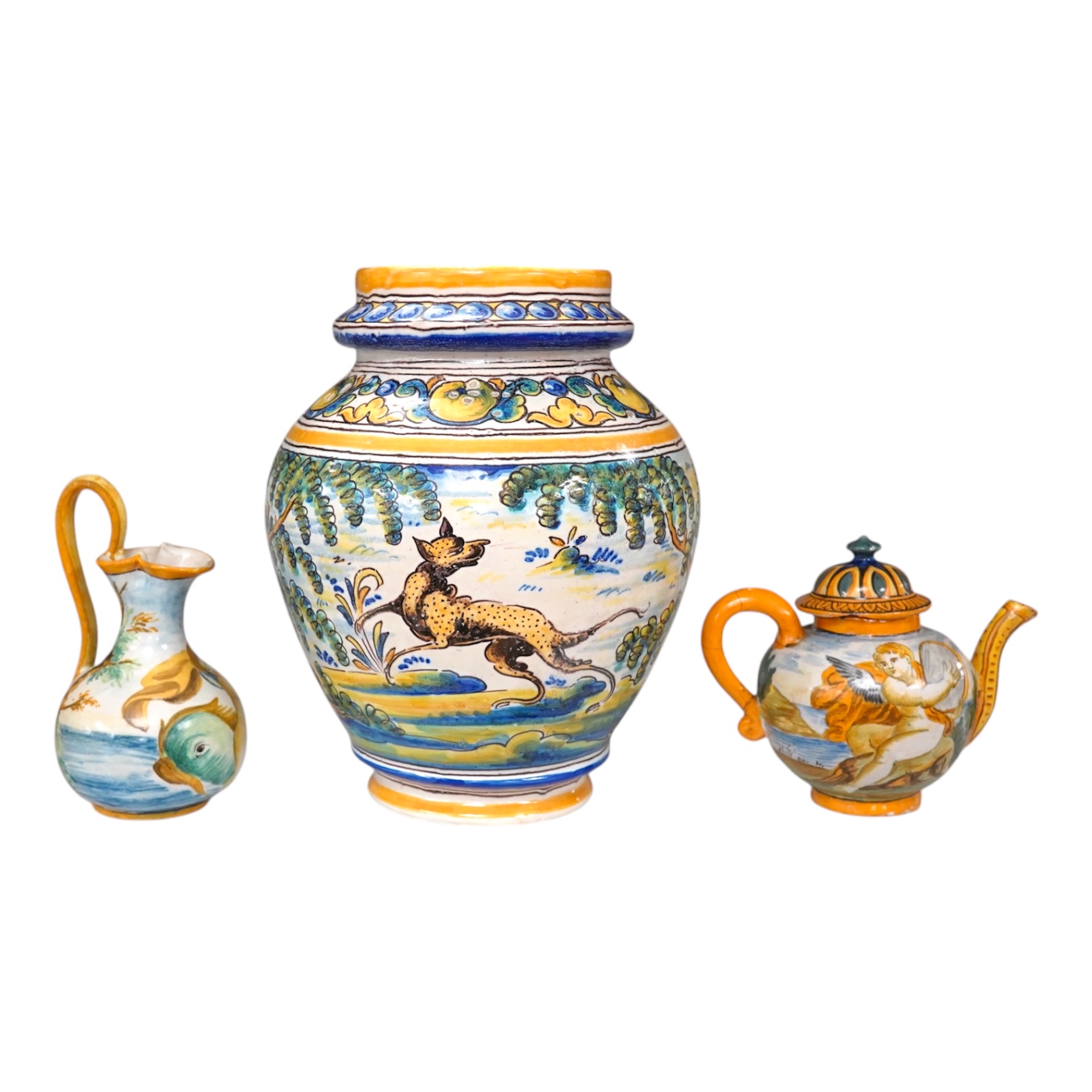 An Italian maiolica teapot and jug and a Talavera maiolica vase, 25cm high (3). Condition - jar good, teapot restored and cracked